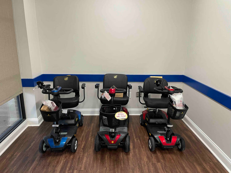 In-Stock & Ready for Pick-Up: Three mobility scooters available for purchase in a retail store.