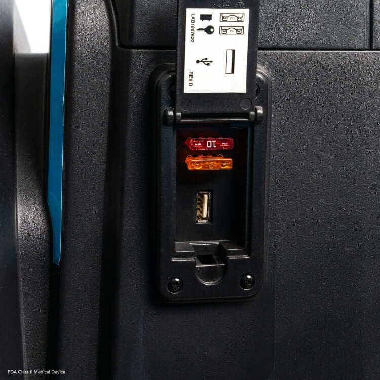 Close-up of PX4 Ultra Heavy Duty Scooter's NFC ignition and USB charging port with fuses.