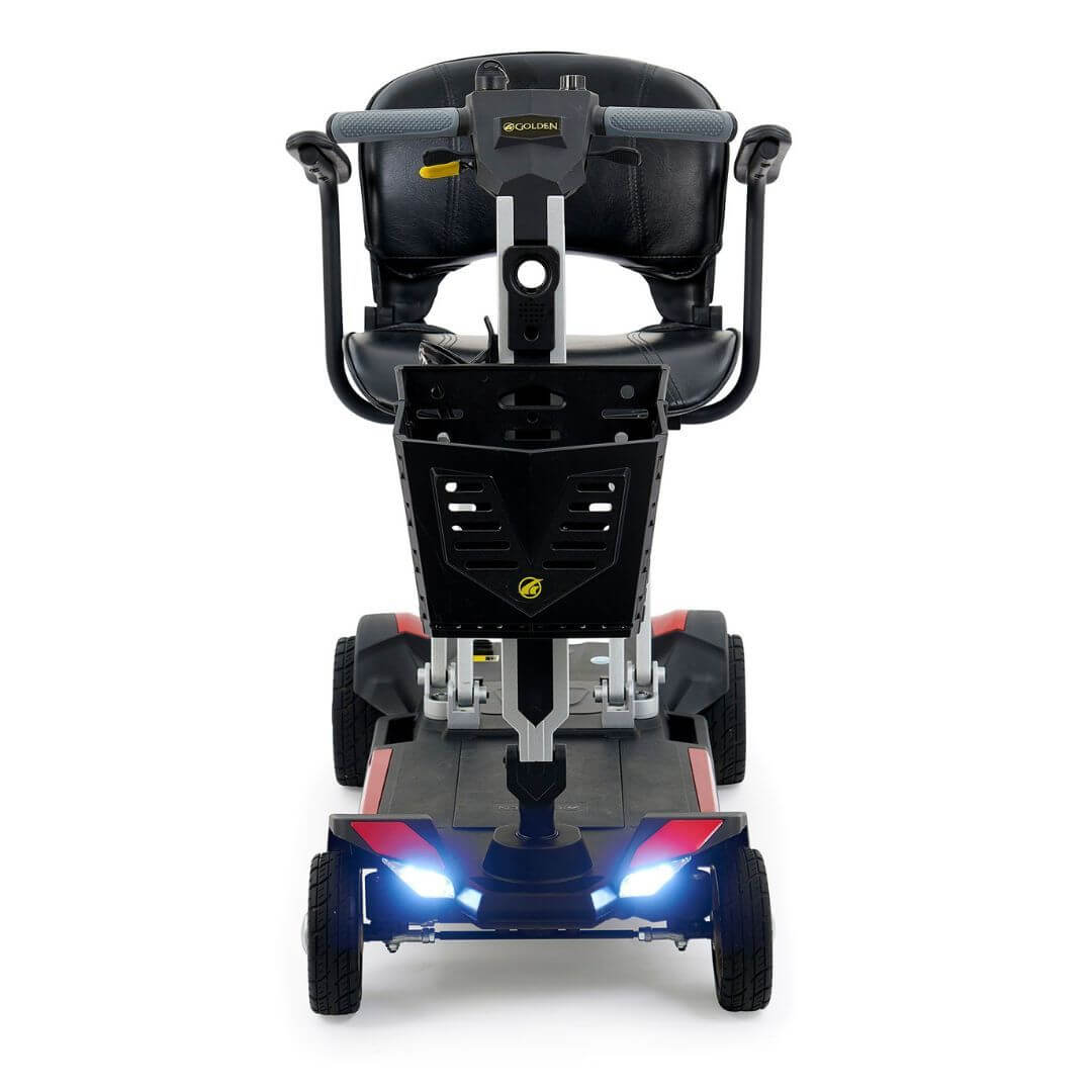 Front view of Buzzaround CarryOn folding scooter, lightweight mobility with LED lights, perfect for travel.