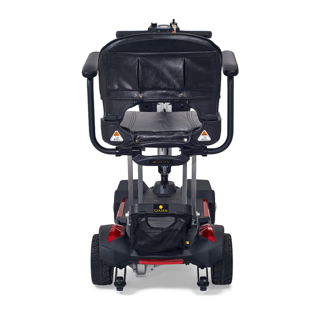 Rear view of the Buzzaround CarryOn folding scooter, showcasing its compact design and comfortable seat for travel.