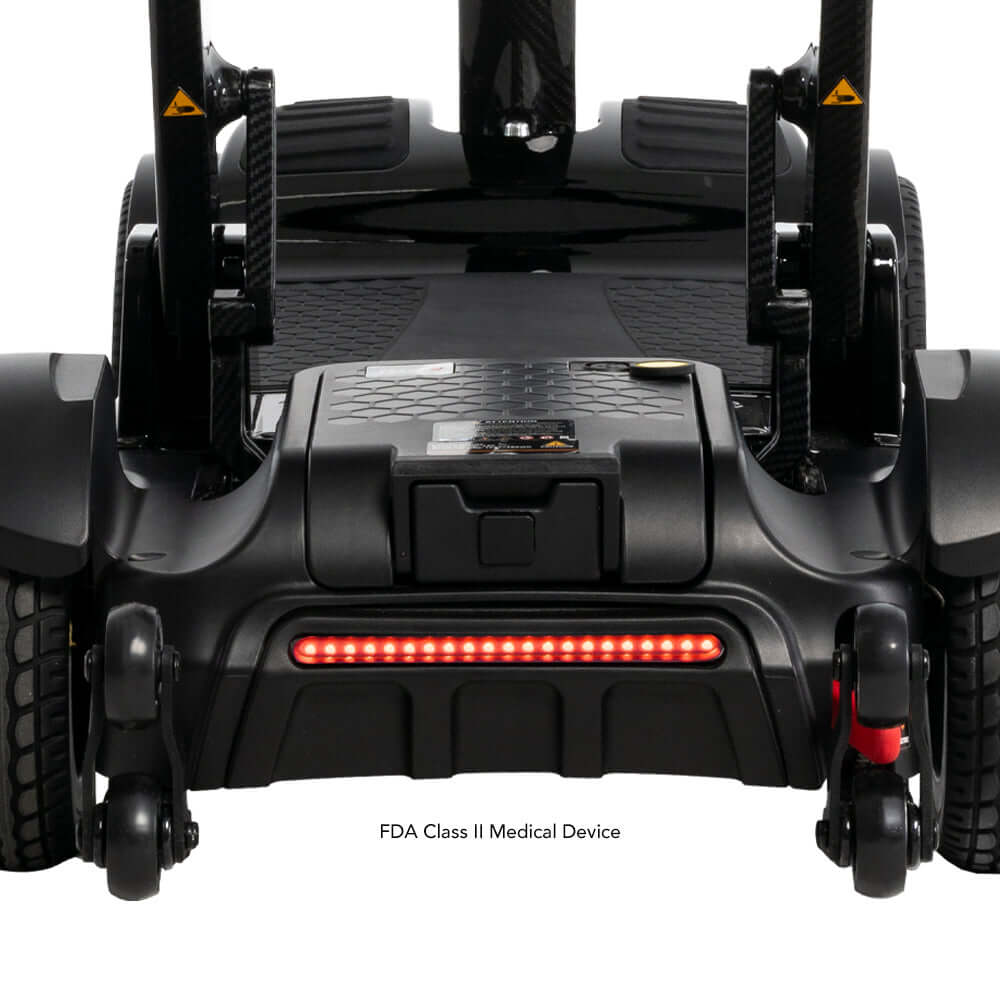 Go Go® Carbon Folding Mobility Scooter rear view showcasing LED lights and FDA Class II medical device label.